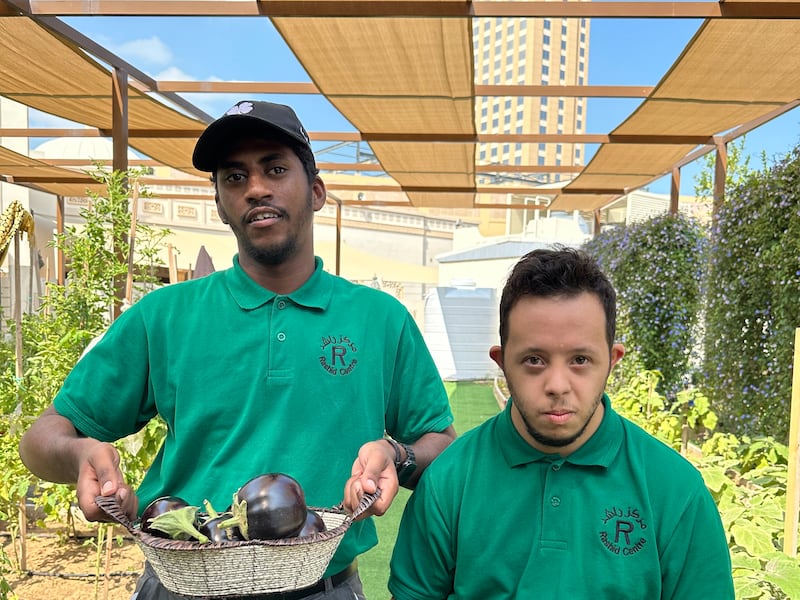Ali Abdeulmajeed, left, and Ezzeldin Esam are students in the gardening workshop. 