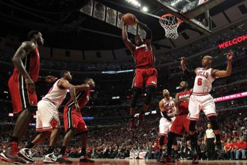 Miami's Dwyane Wade controls a rebound against the Chicago Bulls in Game Five of the Eastern Conference finals on Thursday. His late charge helped the Heat to a 83-80 victory to send his side to the NBA Finals, where they will face the Dallas Mavericks.