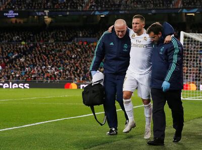 FILE PHOTO: Soccer Football - Champions League - Group A - Real Madrid v Paris St Germain - Santiago Bernabeu, Madrid, Spain - November 26, 2019  Real Madrid's Eden Hazard receives medical attention after sustaining an injury   REUTERS/Susana Vera/File Photo