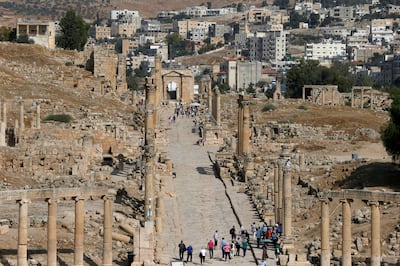 Tourists walk next to ancient Roman landmarks during their visit to Jerash. Reuters