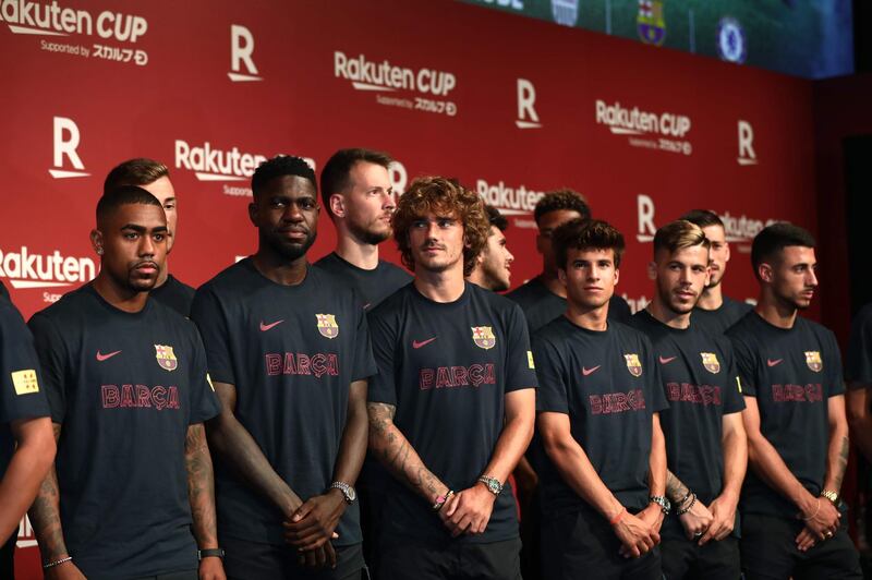 Barcelona players pose for the camera in Tokyo. AFP