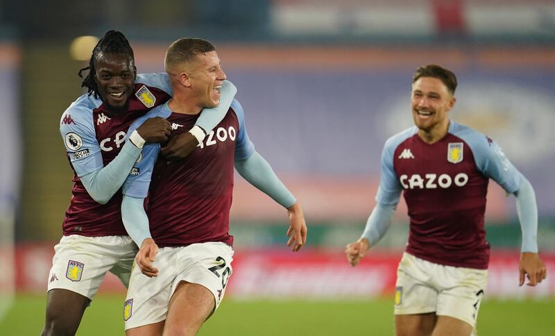 LEICESTER, ENGLAND - OCTOBER 18: Ross Barkley of Aston Villa celebrates with teammates Bertrand Traore and Matty Cash after scoring his team's first goal during the Premier League match between Leicester City and Aston Villa at The King Power Stadium on October 18, 2020 in Leicester, England. Sporting stadiums around the UK remain under strict restrictions due to the Coronavirus Pandemic as Government social distancing laws prohibit fans inside venues resulting in games being played behind closed doors. (Photo by Jon Super - Pool/Getty Images)