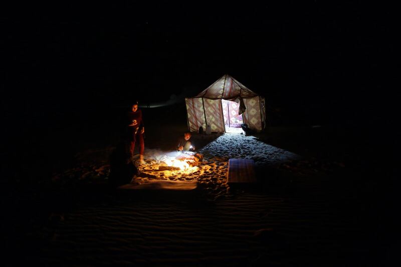 Tourists camp on Maghrafa Mountain near Bawiti in Egypt. EPA