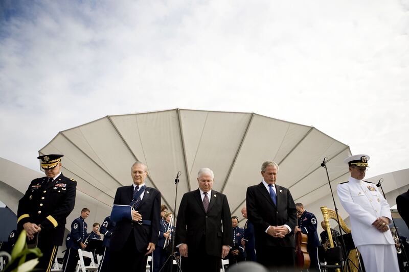 Donald Rumsfeld, second from left, during a Pentagon Memorial dedication ceremony in Arlington, Virginia, on the 2008 anniversary of the 9/11 terror attacks. Bloomberg