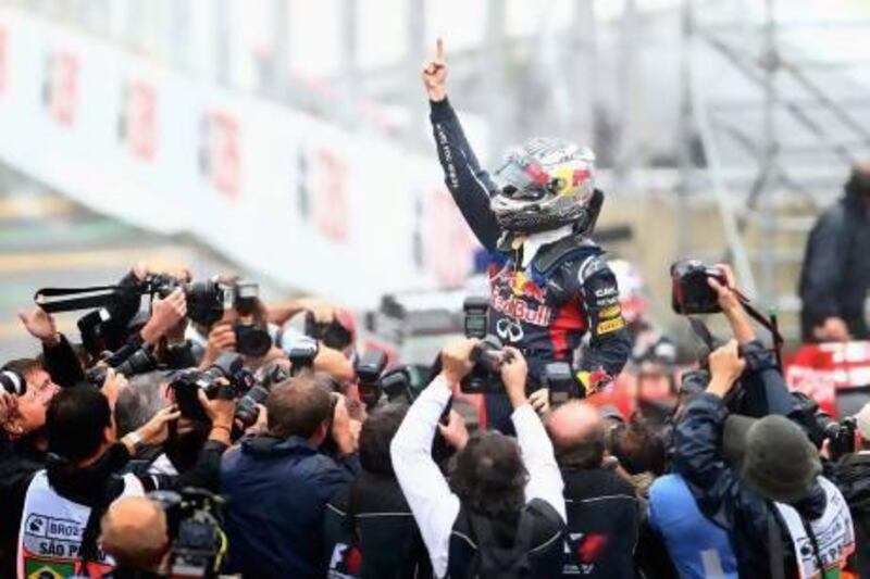 SAO PAULO, BRAZIL - NOVEMBER 25: Sebastian Vettel of Germany and Red Bull Racing celebrates in parc ferme as he finishes in sixth position and clinches the drivers world championship during the Brazilian Formula One Grand Prix at the Autodromo Jose Carlos Pace on November 25, 2012 in Sao Paulo, Brazil. (Photo by Clive Mason/Getty Images) *** Local Caption *** 156934319.jpg