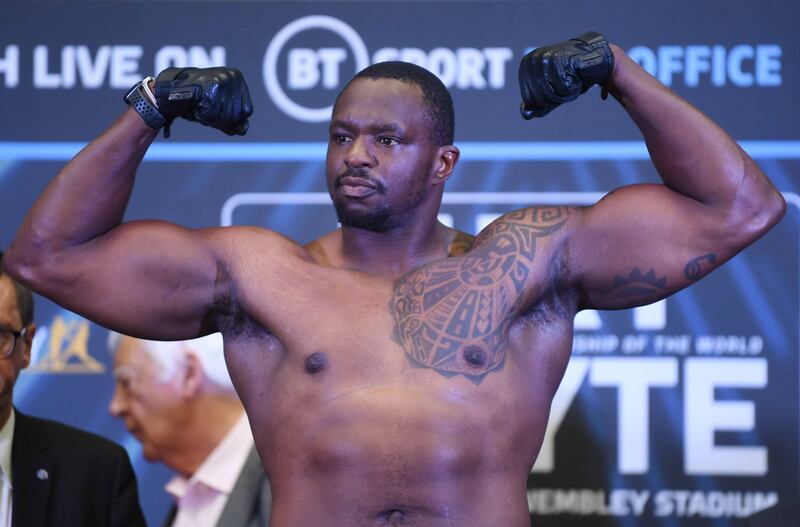 Dillian Whyte stands on the scales. EPA