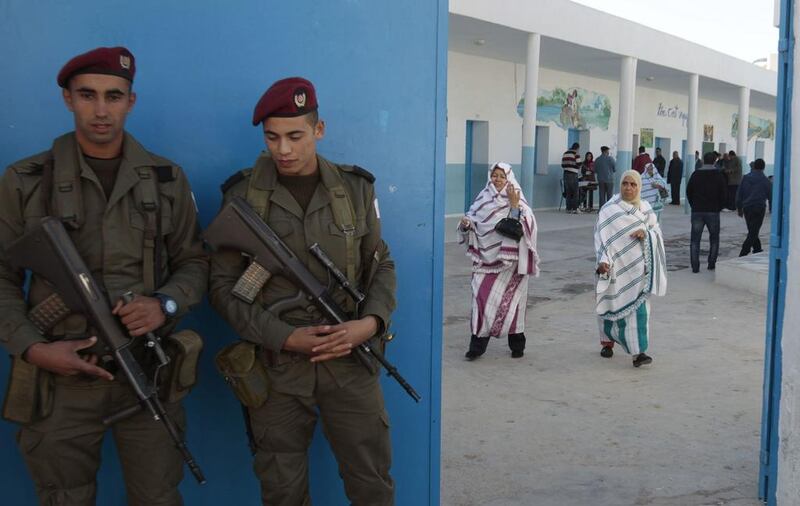 Tunisian soldiers guard a polling station during a presidential run-off election in Sousse. One gunman was killed by Tunisian troops and three others arrested after they attacked a different voting station in the central Kairouan governate late on Saturday, hours before polls opened for a presidential run-off, a defence ministry official said on Sunday. Zoubeir Souiss/ Reuters