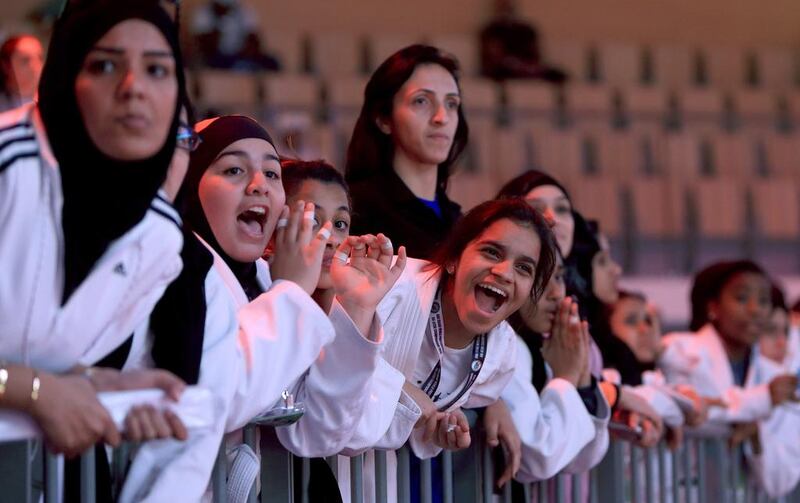 Audiences cheering their fellow participants on Monday at the Abu Dhabi Jiu-Jitsu Children's World Championship at IPIC Arena. Ravindranath K / The National