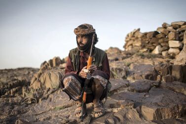 A member of Yemeni resistance forces of Abu Jabr brigade is seen near a front line position in Zi Naem town of Al-Bayda governorate. Asmaa Waguih for The National