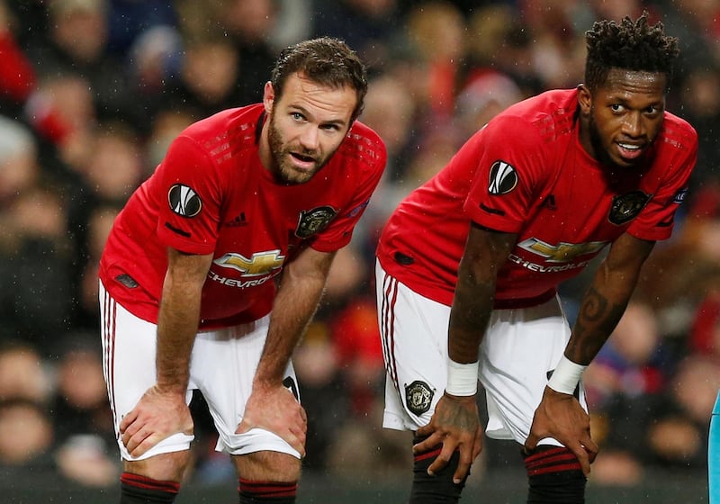 Manchester United's Juan Mata, left, and Fred take a breather. Reuters