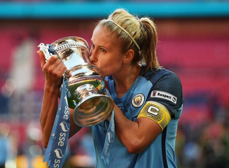 Steph Houghton of Manchester City kisses the trophy.