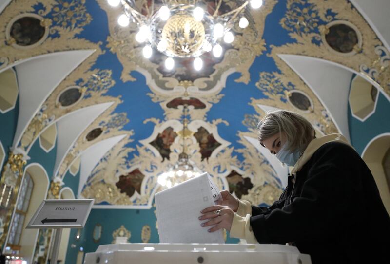 A woman casts her ballot on the last day voting in Moscow, Russia. Reuters