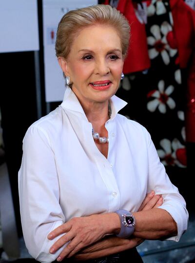 (FILES) This file photo taken on September 08, 2014 shows 
fashion designer Carolina Herrera, standing backstage before previewing her Spring/Summer 2015 collection during New York Fashion Week.
It was announced February 9, 2018 that Carolina Herrera, queen of elegance and favorite of US first ladies, is stepping down as chief designer of her eponymous label. The Venezuelan-born 79-year-old said she had appointed US designer Wes Gordon to take over as creative director after she takes the bow at her fall/winter 2018 fashion show at the Museum of Modern Art in Manhattan. / AFP PHOTO / Joshua LOTT