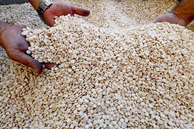 Members of the Naples branch of the Italian Guardia di Finanza (GdF) law enforcement agency inspect a world record seizure of a 14-tonne haul of amphetamines.  EPA