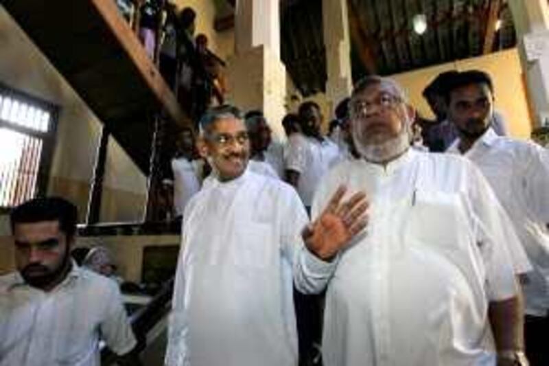 Sri Lanka's former army chief Gen. Sarath Fonseka, second left, arrives at the temple of tooth with his supporters, before starting his campaigning in Kandy, Sri Lanka, Monday, Nov. 30, 2009. Fonseka has announced that he will run for president as head of a coalition of opposition parties, pitting himself against President Mahinda Rajapaksa. (AP Photo/Eranga Jayawardena) *** Local Caption ***  DEL102_Sri_Lanka_Elections_.jpg *** Local Caption ***  DEL102_Sri_Lanka_Elections_.jpg