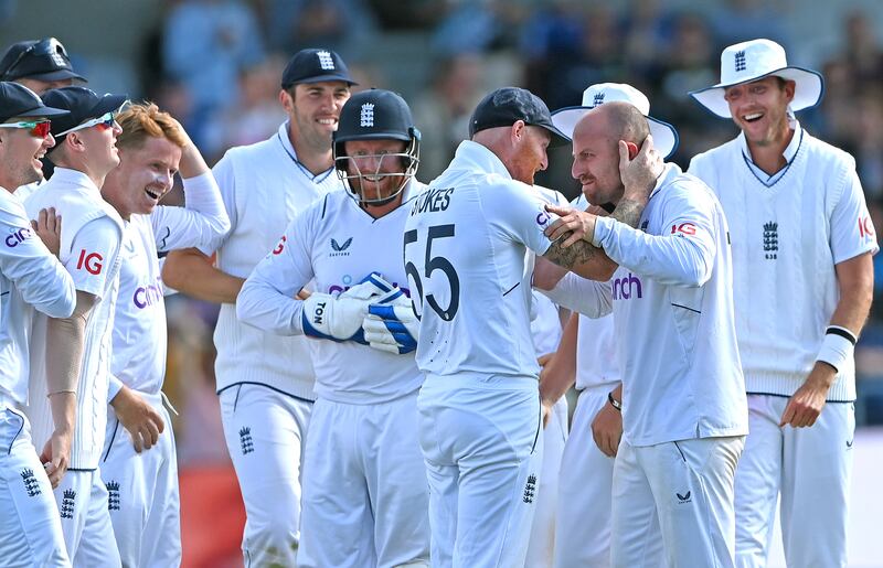 England spinner Jack Leach is congratulated by captain Ben Stokes after dismissing Henry Nicholls on Day 3 of the third Test at Headingley on Saturday, June 25, 2022. Getty