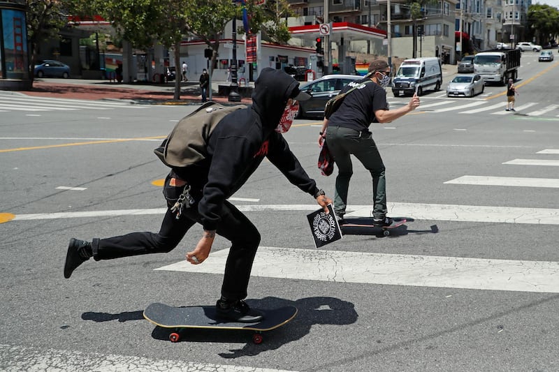 Skateboarders take part in a Black Lives Matter protest skating from Twin Peaks down to Market Street while blocking traffic in The Castro, San Francisco, California.  EPA