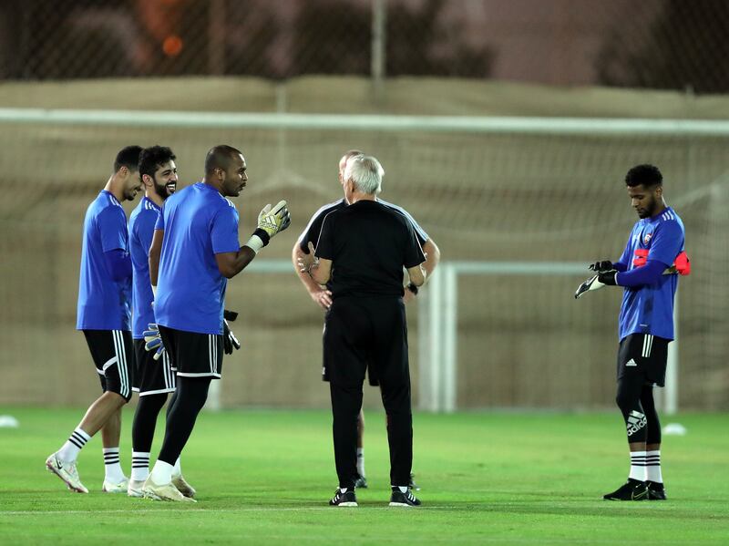 UAE manager Bert van Marwijk with Ali Khaseif during training. Chris Whiteoak / The National