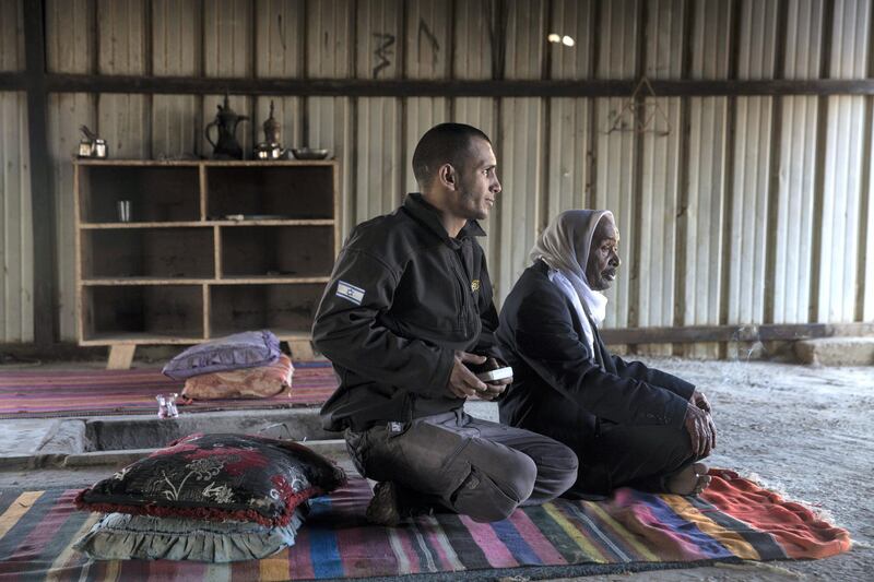 Sabah Hakesharah,87, with his son Omar in the unrecognized village of al-Poraa near the city of Arad in the Negev Desert on February 2,2018. They are amongst the thousands of Bedouins living an area in which there is a plan being discussed to build a giant phosphate mine which they fear could not only risk their health but force them to be evicted from where they have lived for generations .(Photo by Heidi Levine for The National).
