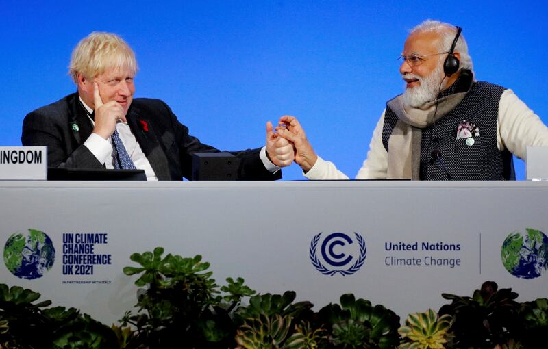 Boris Johnson and India's Prime Minister Narendra Modi bond at a meeting. AP Photo