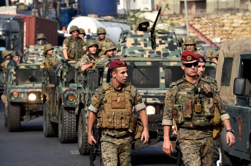 Lebanese army convoy waits for a blocked road to be open.  EPA