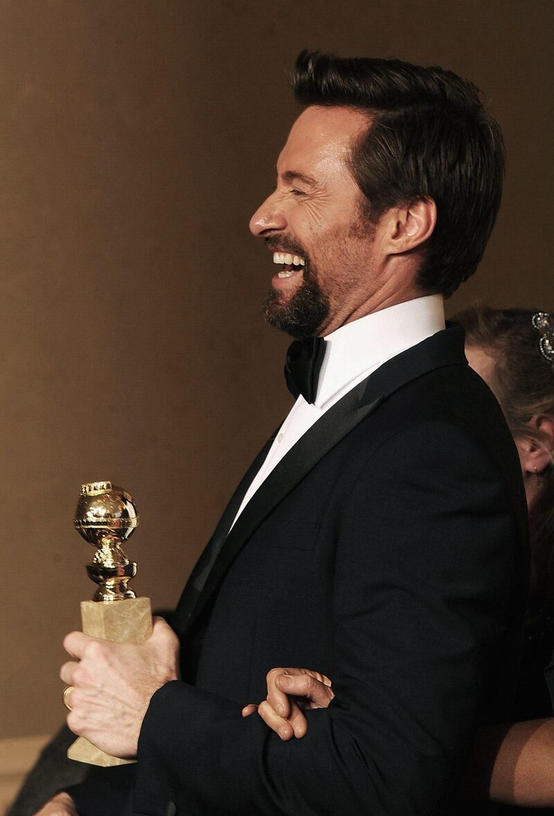 Actor Hugh Jackman poses with Best Actor in a Musical or Comedy Award in the press room during the 70th Annual Golden Globe Awards held at The Beverly Hilton Hotel on January 13, 2013 in Beverly Hills, California.   Kevin Winter/Getty Images/AFP== FOR NEWSPAPERS, INTERNET, TELCOS & TELEVISION USE ONLY ==
 *** Local Caption ***  252478-01-09.jpg
