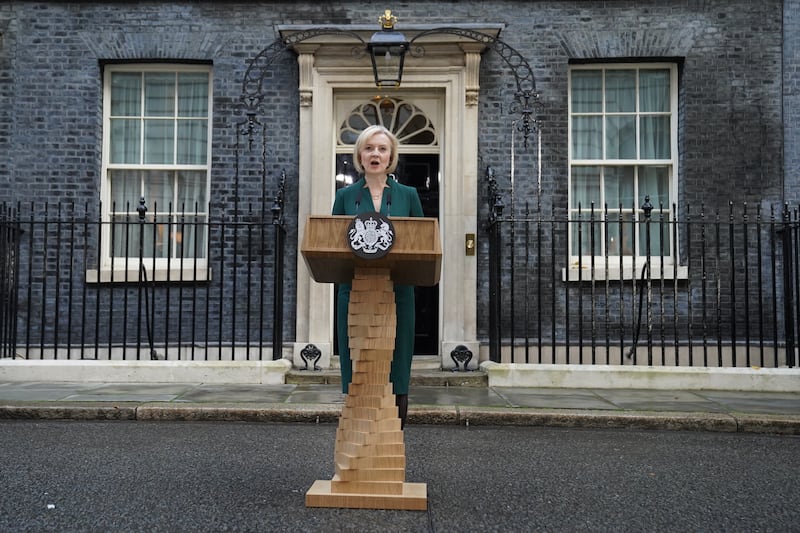 Outgoing Prime Minister Liz Truss makes a speech outside 10 Downing Street before travelling to Buckingham Palace to formally resign. Ms Truss's lectern has been likened to a Jenga tower. PA