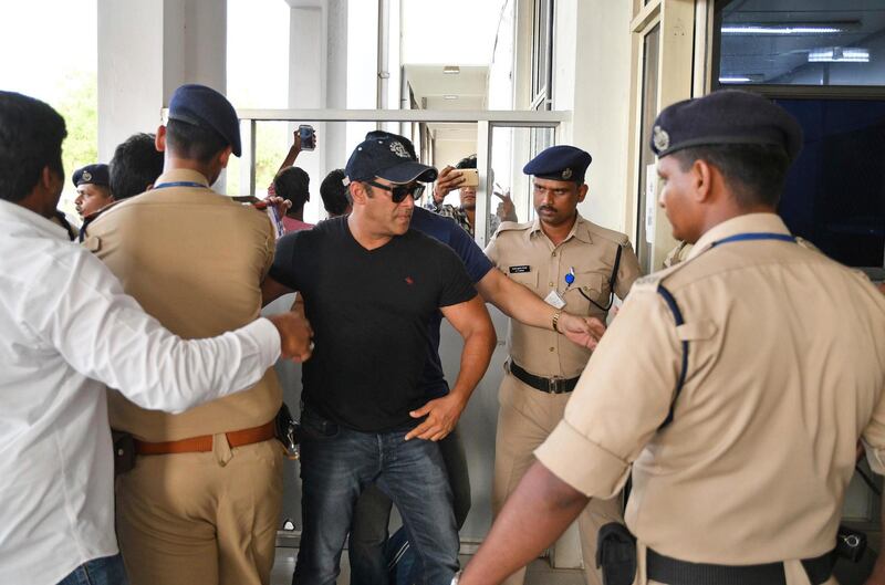 Bollywood star Salman Khan arrives at the airport after he was granted bail in Jodhpur, Rajasthan state, India, Saturday, April 7, 2018.  A court on Saturday granted bail to Khan, who is appealing his conviction on charges of poaching rare deer in a wildlife preserve two decades ago. Khan was sentenced Thursday to five years in prison on the charges and was immediately sent to jail. Judge Ravindra Kumar Joshi ordered him to sign a surety bond of 50,000 rupees ($770) on Saturday before he could be set free in Jodhpur, a town in western India. (AP Photo/Sunil Verma)