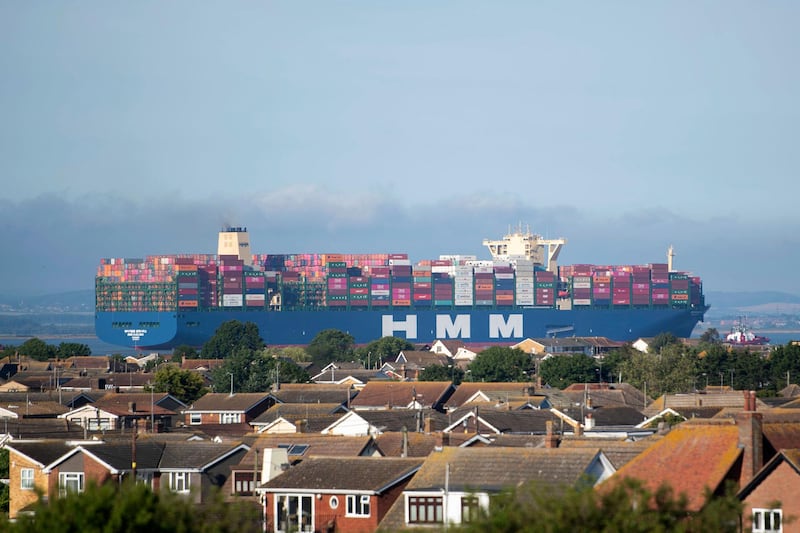 HMM Algeciras, the world's largest container ship, passes Canvey Island in Essex as it arrives in the UK for the first time, in Canvey Island, England, Sunday June 14, 2020. The vessel concluded its journey from China, to deliver goods to DP World London Gateway in Thurrock.   AP