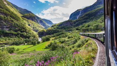 The Flamsbana train journey travels between Flam and Myrdal in Western Norway. Getty