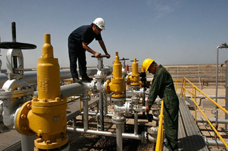 Iranian technicians work in the Azadegan oilfield. The country’s energy sector is under pressure from sanctions. AP Photo