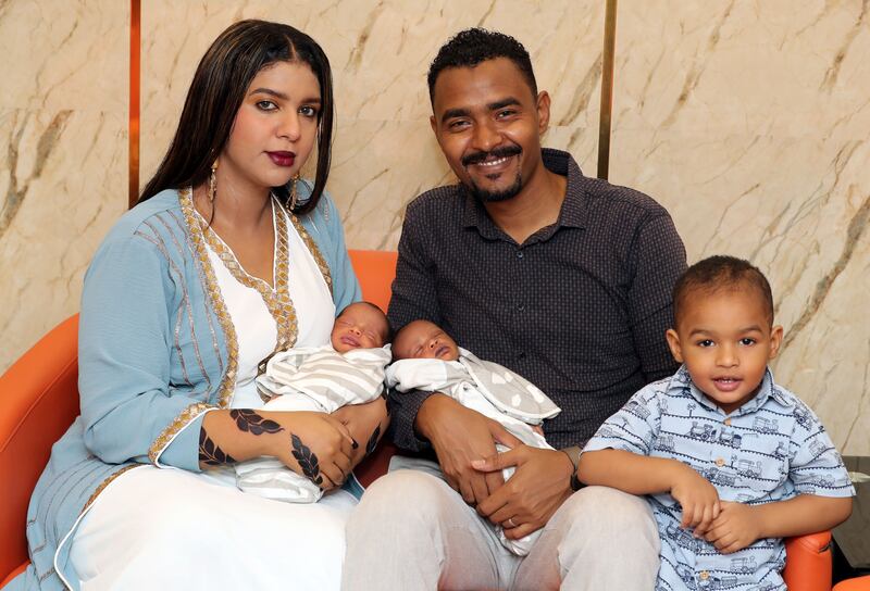 Aasim Omer and his wife Duaa Mustafa with their twins and two-year-old son Aasir. Photo: Chris Whiteoak/The National