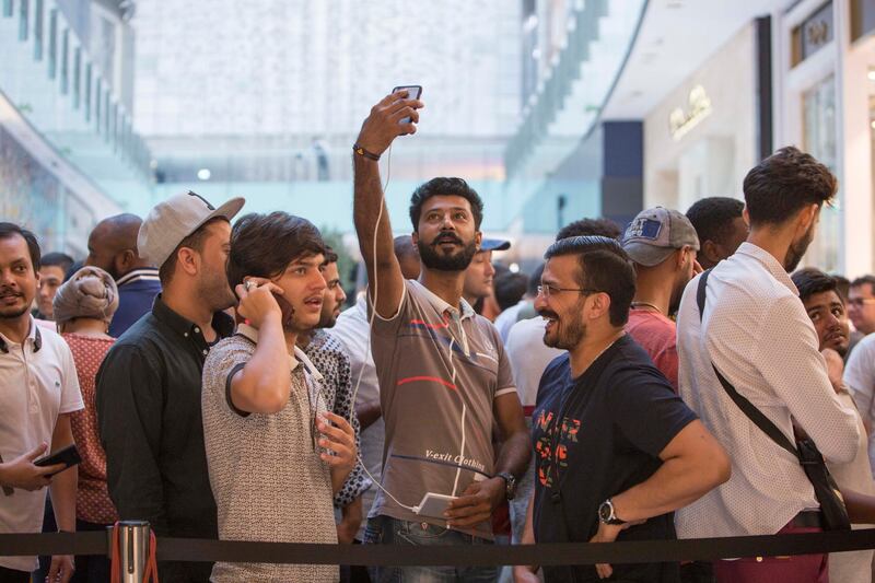 DUBAI, UNITED ARAB EMIRATES, 21 SEPTEMBER 2018 - Crowd at Iphone XS launch at Apple store Dubai Mall.  Leslie Pableo for The National