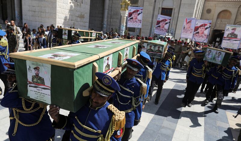 Honour guards carry the coffins of Houthi fighters during a funeral in Sanaa, Yemen, September 25, 2021. Reuters