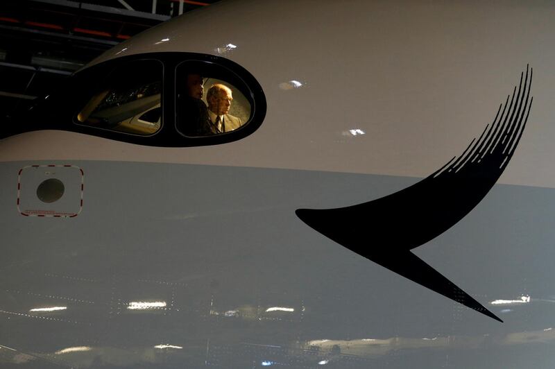 FILE PHOTO: Pilots look out from the cockpit of a Cathay Pacific Airways Airbus A350 as the airlines hold a ceremony to mark the first of their 48 Airbus A350 arriving at Hong Kong Airport, Hong Kong, China May 30, 2016. REUTERS/Bobby Yip/File Photo