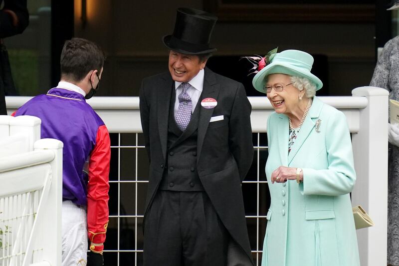 Queen Elizabeth II and racing manager John Warren speak with jockey Oisin Murphy during day five of Royal Ascot. PA Images