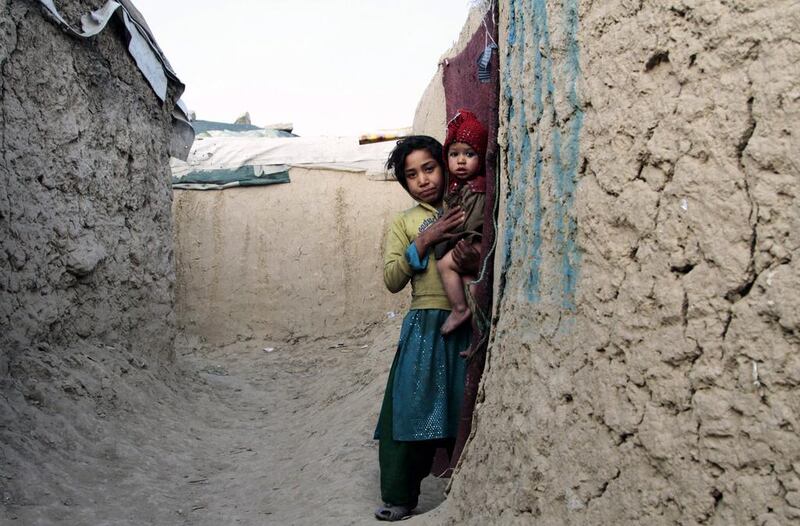 Internally displaced Afghan children take shelter in a camp on the outskirts of Kabul. Photo: Hedaytullah Amid /  EPA