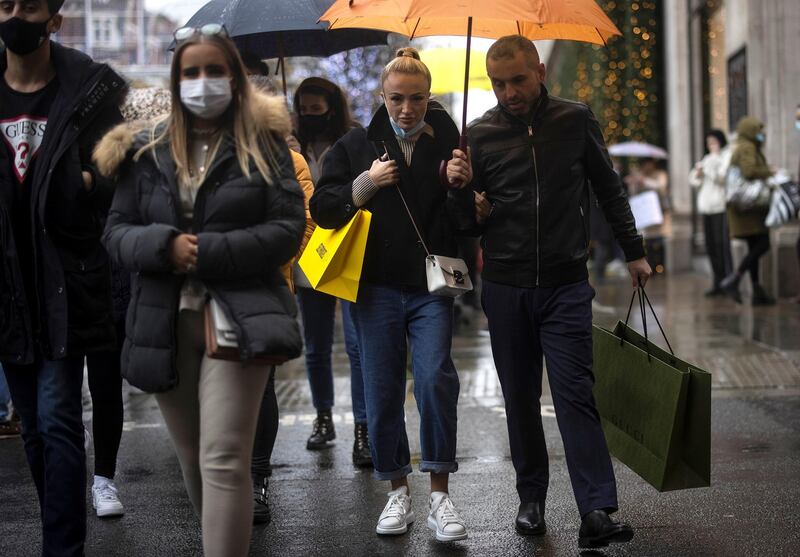 Shoppers walk down Oxford Street, amid the coronavirus disease (COVID-19) outbreak in London, Britain, December 13, 2020. REUTERS/Simon Dawson