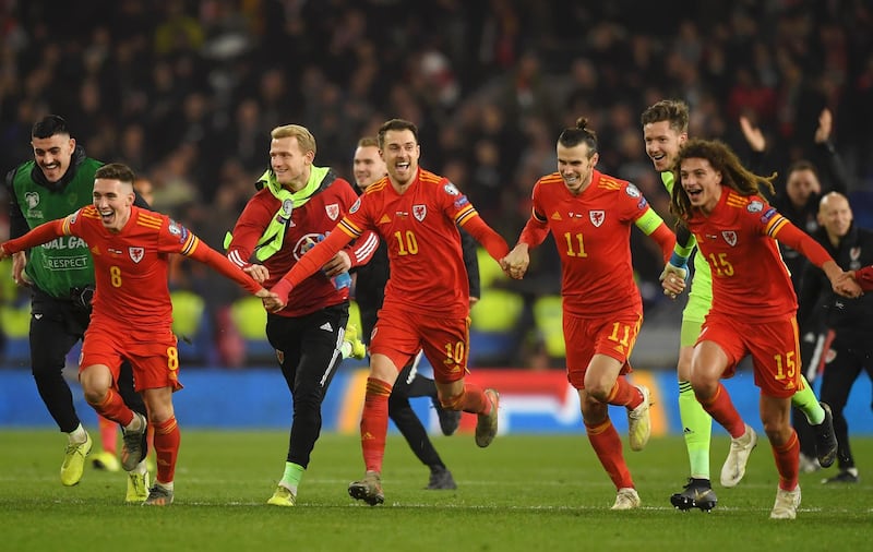 Wales' players celebrate victory and qualification for the Euro 2020 finals. Getty