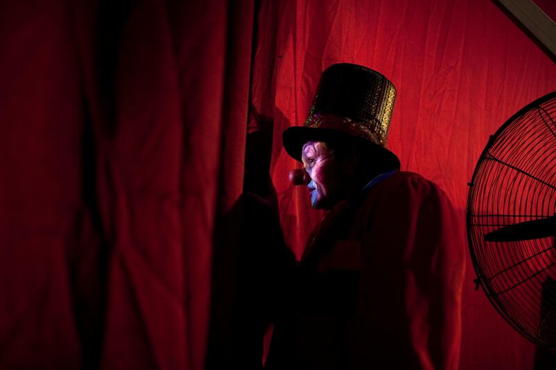 Abu Dhabi, United Arab Emirates, April 28, 2013: 
A clown peeks through the backstage curtain as he prepares for his performance at the Monte Carlo circus on Sunday, April 28, 2013, at the circus new temporary location in Mussafah, an industrial subsection of Abu Dhabi. 
Silvia Razgova / The National
