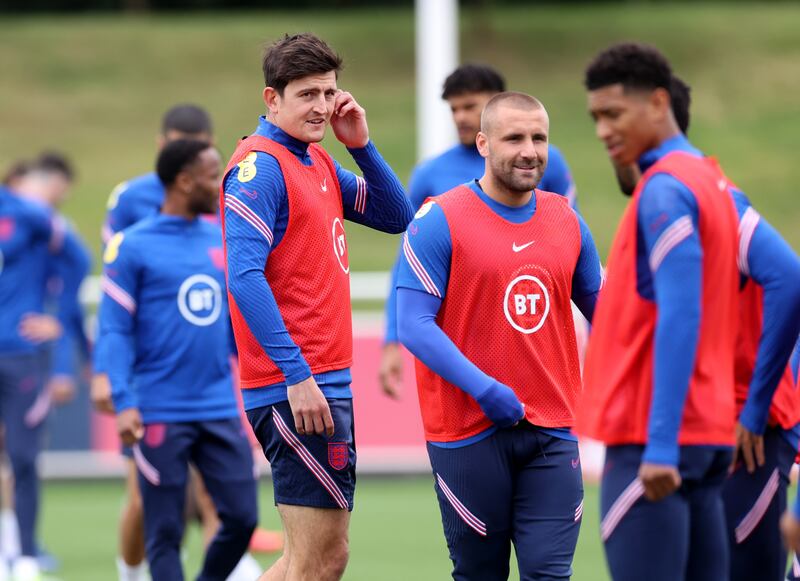 England's Harry Maguire and Luke Shaw with teammates.