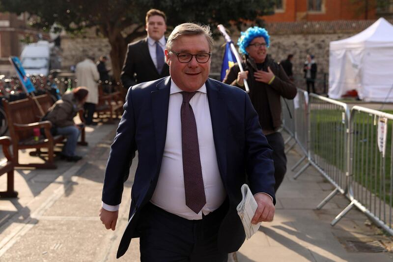 Pro-Brexit Conservaitve MP Mark Francois walks near the Houses of Parliament in central London on April 3, 2019. Prime Minister Theresa May met Wednesday with Britain's opposition leader in a bid to forge a Brexit compromise that avoids a potentially chaotic "no-deal" departure from the EU in nine days. May tore up her steadfast strategy and sought Labour leader Jeremy Corbyn's support in a surprise last-minute move that could determine the fate of the country and her government. / AFP / ISABEL INFANTES
