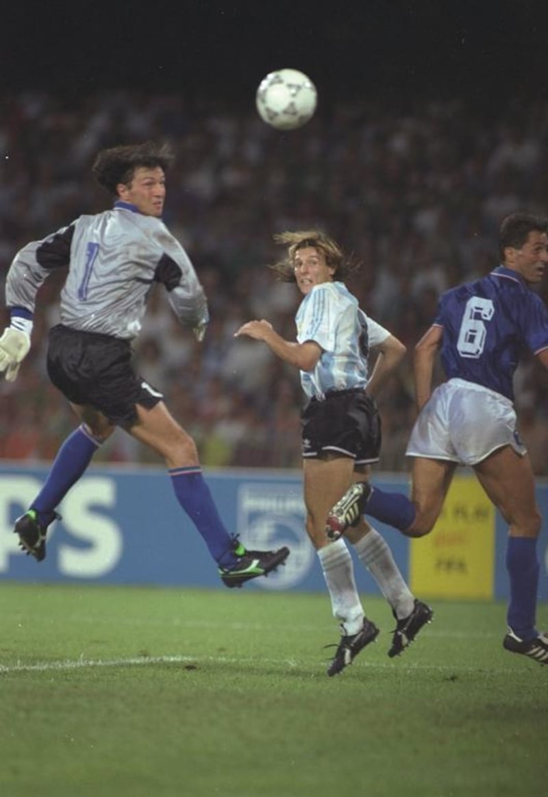 Claudio Canniggia, centre, of Argentina heads the ball past Walter Zenga the Italian goalkeeper during the 1990 World Cup semi-final at the San Paolo stadium in Naples, Italy. The match ended in a 1-1 draw but Argentina won 4-3 on penalties. David Cannon / Allsport