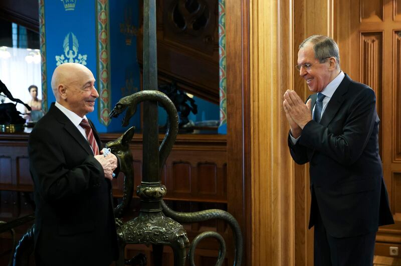In this photo provided by Russian Foreign Ministry Press Service, Russian Foreign Minister Sergey Lavrov, right, greets Libya's parliament speaker Aguila Saleh prior to their talks in Moscow, Russia, Friday, July 3, 2020. Russia's top diplomat met Friday with the speaker of the parliament based in eastern Libya to discuss a political settlement for the conflict-stricken country. (Russian Foreign Ministry Press Service via AP)