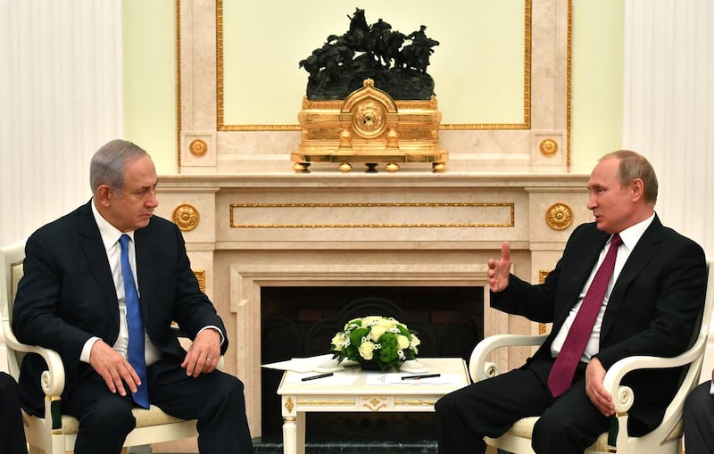 epa06881271 Russian President Vladimir Putin (R) speaks with Israeli Prime Minister Benjamin Netanyahu (L) during their meeting at the Kremlin in Moscow, Russia, 11 July 2018. The leaders meet to discuss bilateral cooperation and international issues, including Palestinian-Israeli settlement and the situation in Syria.  EPA/YURI KADOBNOV/POOL