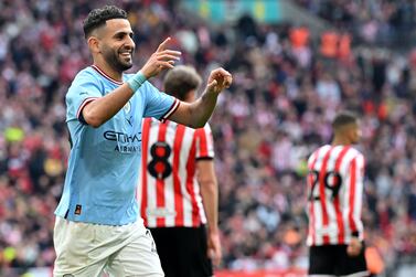 Manchester City's Algerian midfielder Riyad Mahrez celebrates scoring the team's third goal, his hat trick, during the English FA Cup semi-final football match between Manchester City and Sheffield United at Wembley Stadium in north west London on April 22, 2023.  (Photo by Glyn KIRK  /  AFP)  /  NOT FOR MARKETING OR ADVERTISING USE  /  RESTRICTED TO EDITORIAL USE