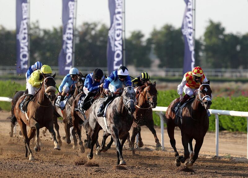 Sharjah, United Arab Emirates - November 28, 2020: Winner of the fifth race Galvanize ridden by Nathan Crosse (red and yellow), in the Sheikh Hamdan bin Rashid Al Maktoum Cup for thoroughbreds. Saturday, November 28th, 2020 in Sharjah. Chris Whiteoak / The National