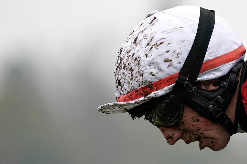Jockey Ciaran Gethings on a muddy day at Ascot Racecourse in England on Saturday November 23. Getty