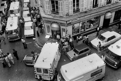 (FILES) This file photo taken on August 9, 1982, view of firemen and a rescuers in the rue des Rosiers after the French-Jewish delicatessen restaurant Jo Goldenberg was attacked on August 9, 1982 in Paris by gunmen that threw a grenade into the restaurant and shot at customers with sub-machine guns, killing six customers and injuring 22 others. More than 38 years later, with the extradition by Norway on December 4, 2020, of one of the four identified suspects, Walid Abdulrahman Abou Zayed, victims of the attack  in Paris's Marais district in August 1982 are finally hoping for answers and a trial in what remains one of the oldest terrorism cases in France. / AFP / Jacques DEMARTHON
