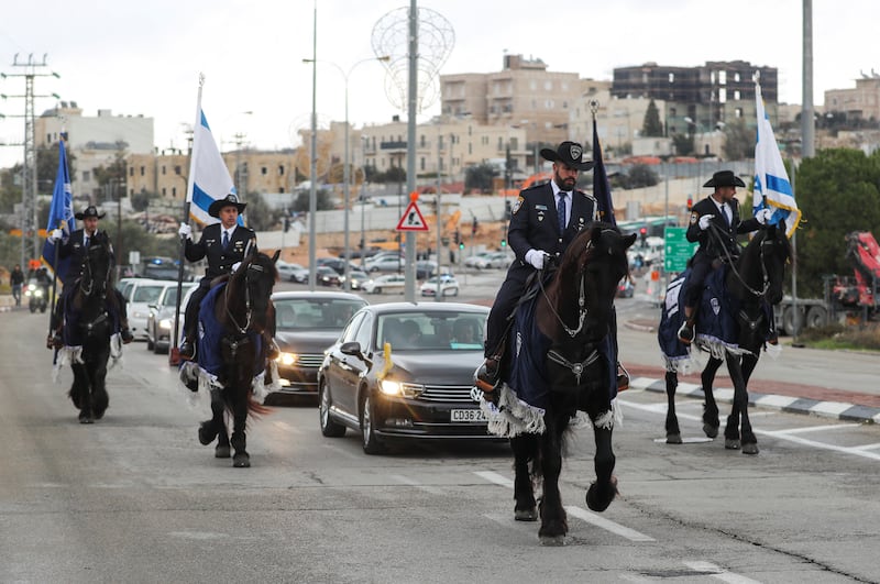 The convoy of Pierbattista Pizzaballa is escorted by mounted Israeli police officers before crossing into Bethlehem. Reuters